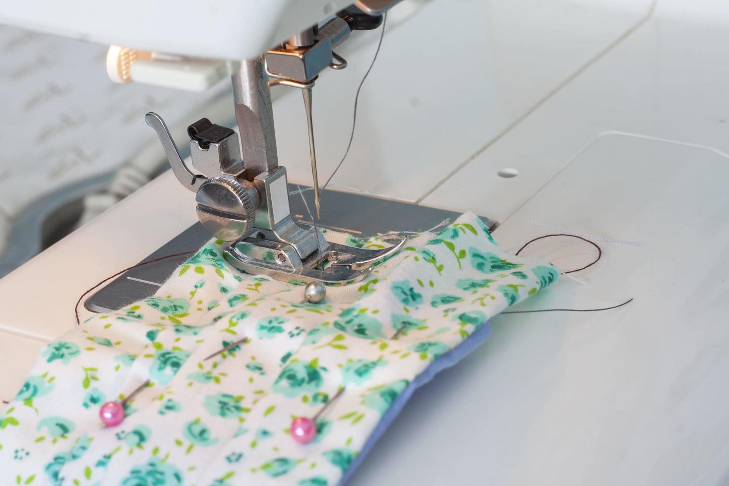 Sew the fabric mask with the sewing machine to prevent the Novel Coronavirus 2019 or Covid-19. Due to the scarce hygienic mask. photo