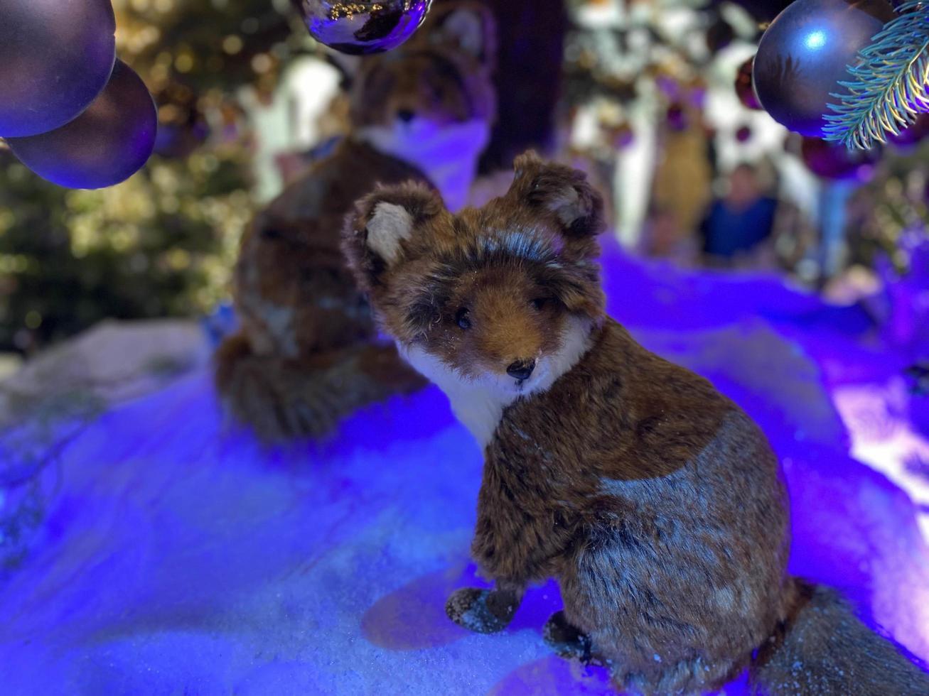 Christmas and New Year Decoration. Musical ensemble of toy foxes under the Christmas tree. New Year concepts photo