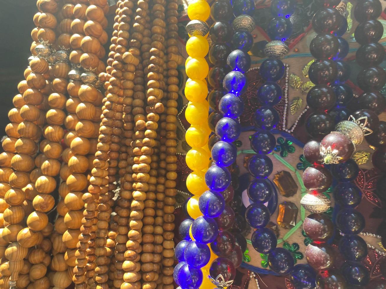 Background pattern of multicolored natural wooden beads photo