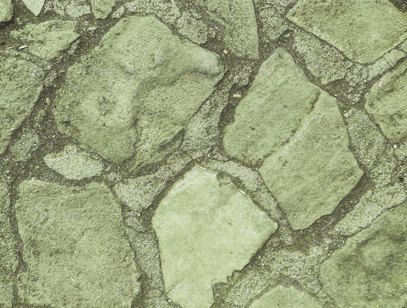 the stone is natural, the path is lined with stones for the convenience of tourists. natural gray texture. large stones of different colors to create roads photo