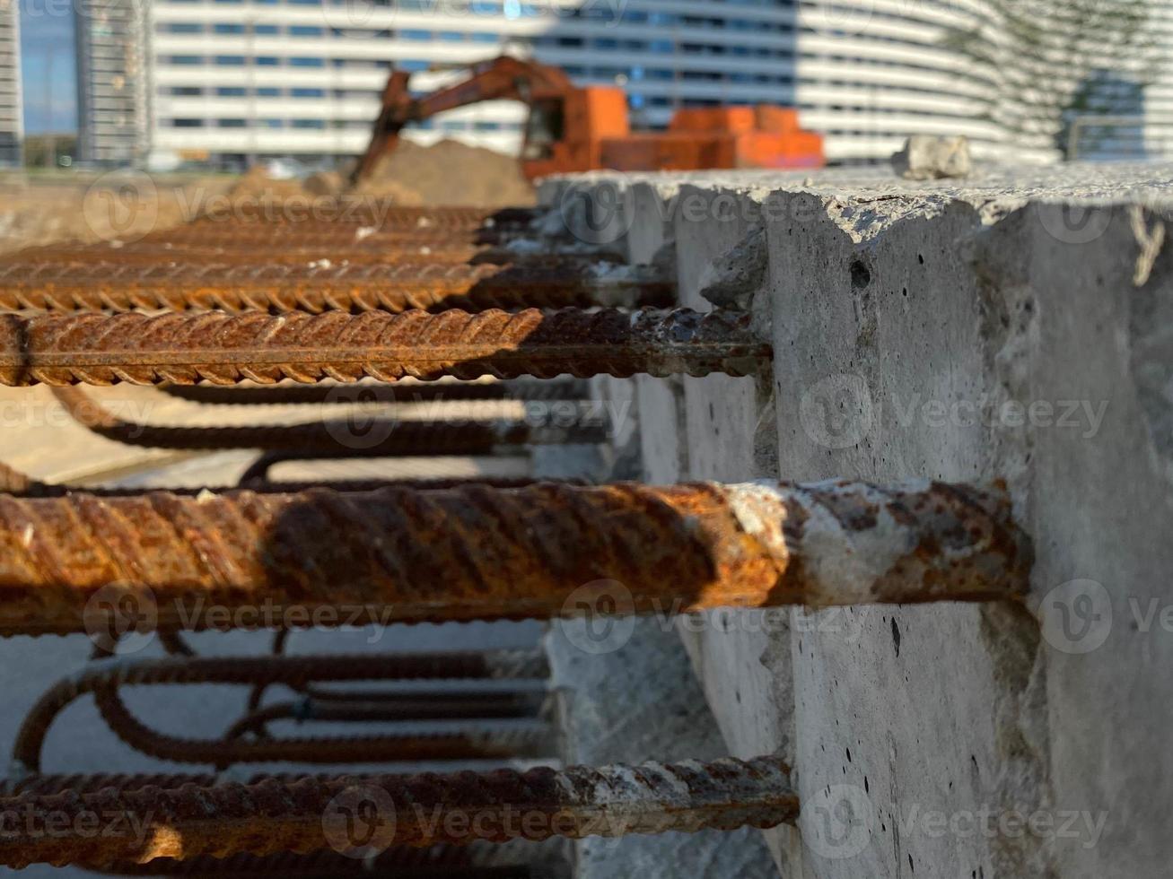Iron metal rusty reinforcement in concrete and industrial reinforced concrete slabs used in the construction of buildings and structures photo