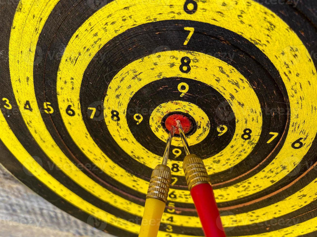 Darts board with arrows hitting the center target, focuses on success, planning to be smart concept photo