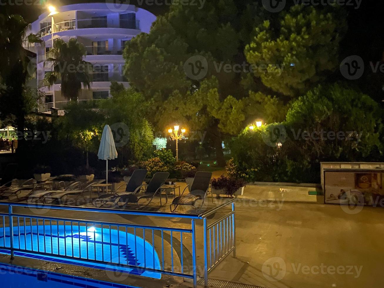 Swimming pool at night in Sharm el Sheikh, Egypt photo