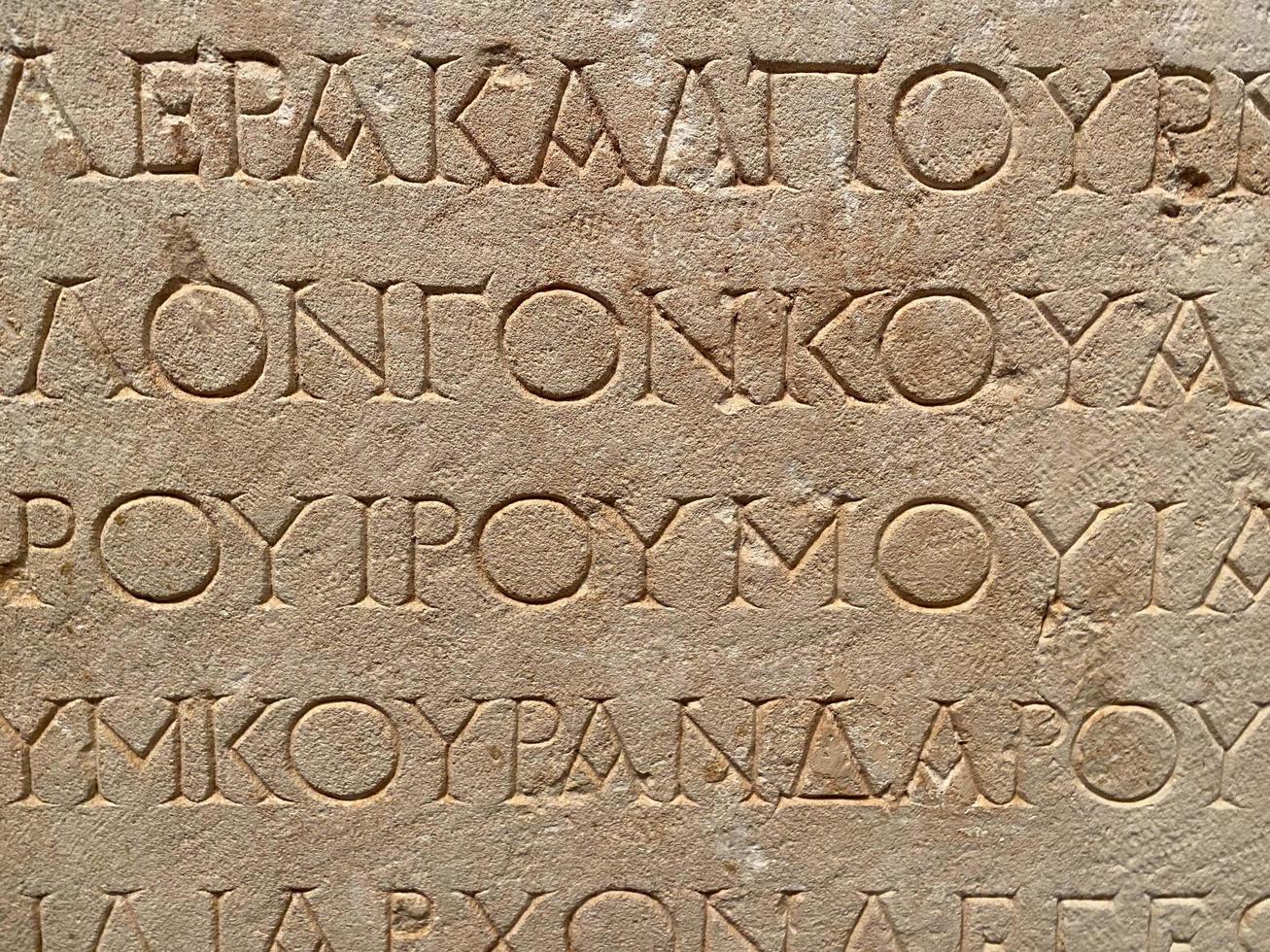 Old Greek writing on sandstone photo