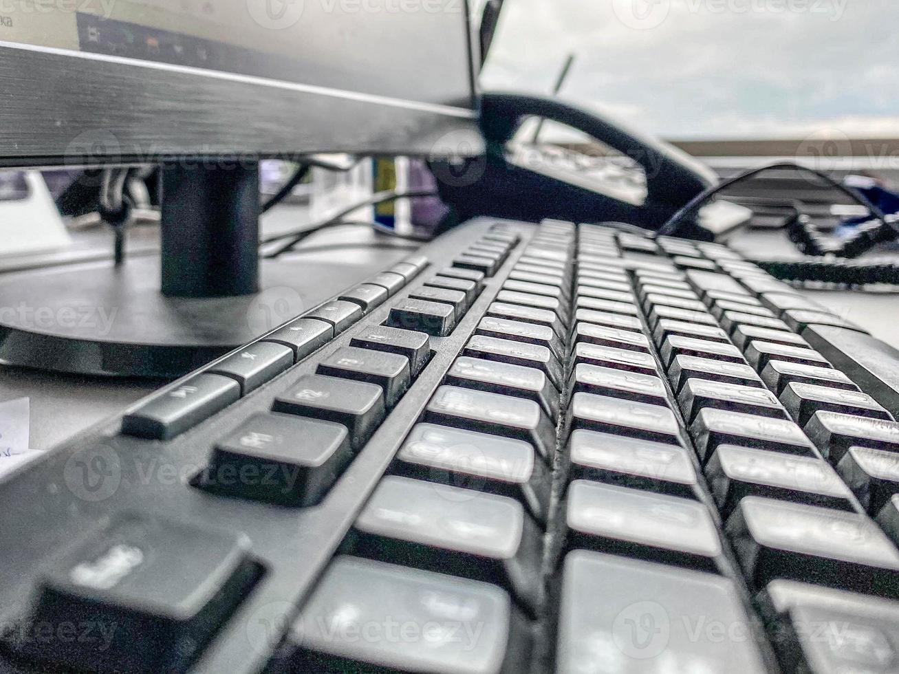 computer keyboard with black release keys. Office equipment. workplace at a desktop computer. keyboard for typing, programming photo