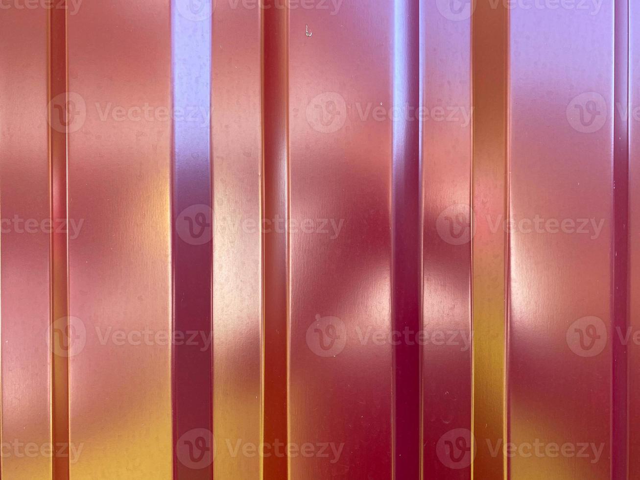 The texture of the iron metal fence and the surface painted with red polymer paint from tin and corrugated board. The background photo