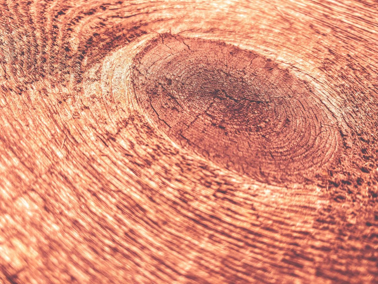 Brown wood texture of natural wood from x planks with knots, close-up view. The background photo