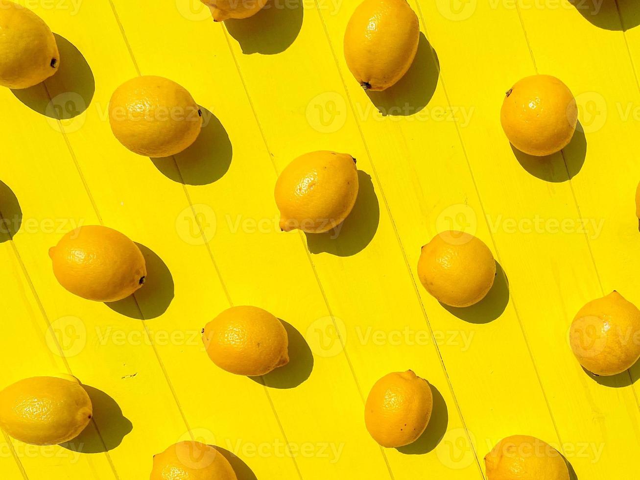 Ripe limes, lemons, mint on white wooden boards, top view, copy space. summer background photo