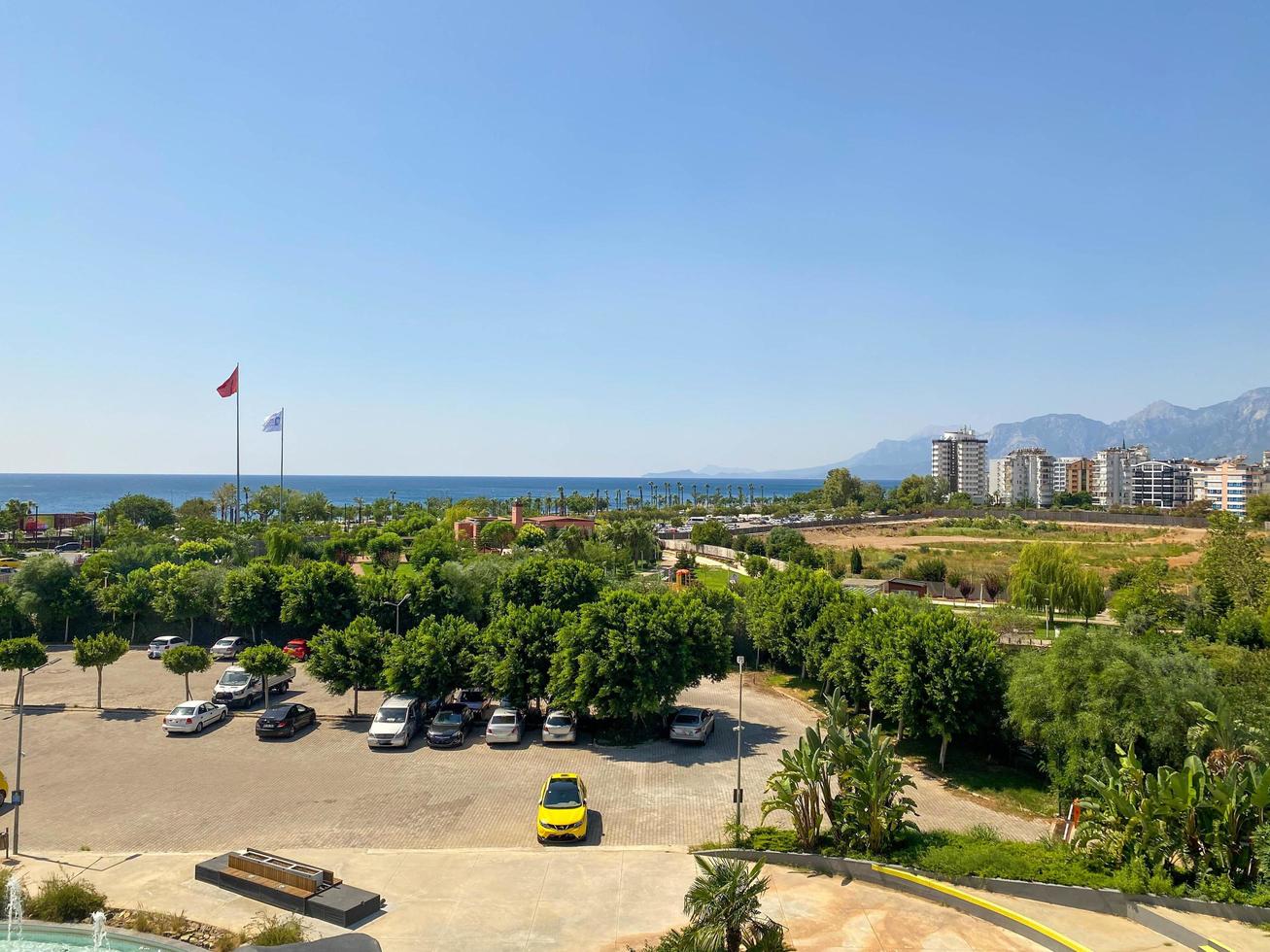 ariel panoramic view of old city and skyscrapers with the sea from the mountains photo