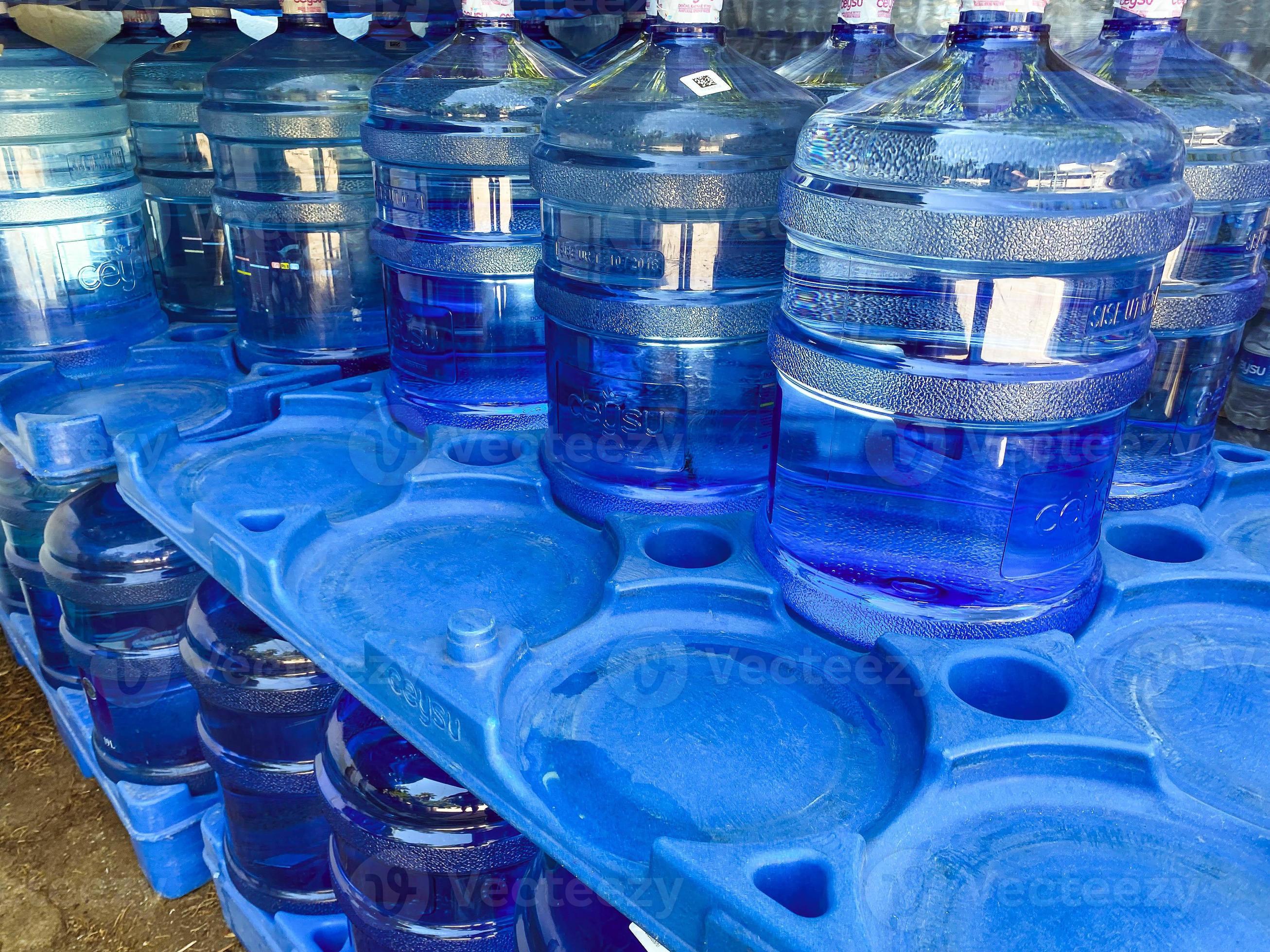 water in large bottles. many containers with purified water. environmental care. extraction and
