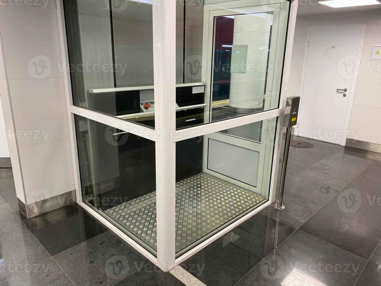 Large new inclusive elevator in the metro or shopping center for people with disabilities and people with disabilities for a barrier-free city environment photo