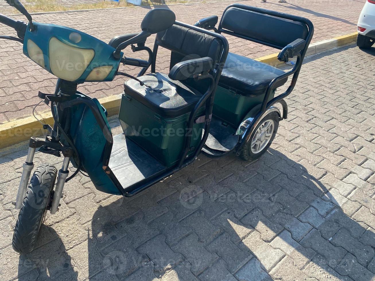 Three-wheeled moped without a roof. Rickshaw in Turkey photo