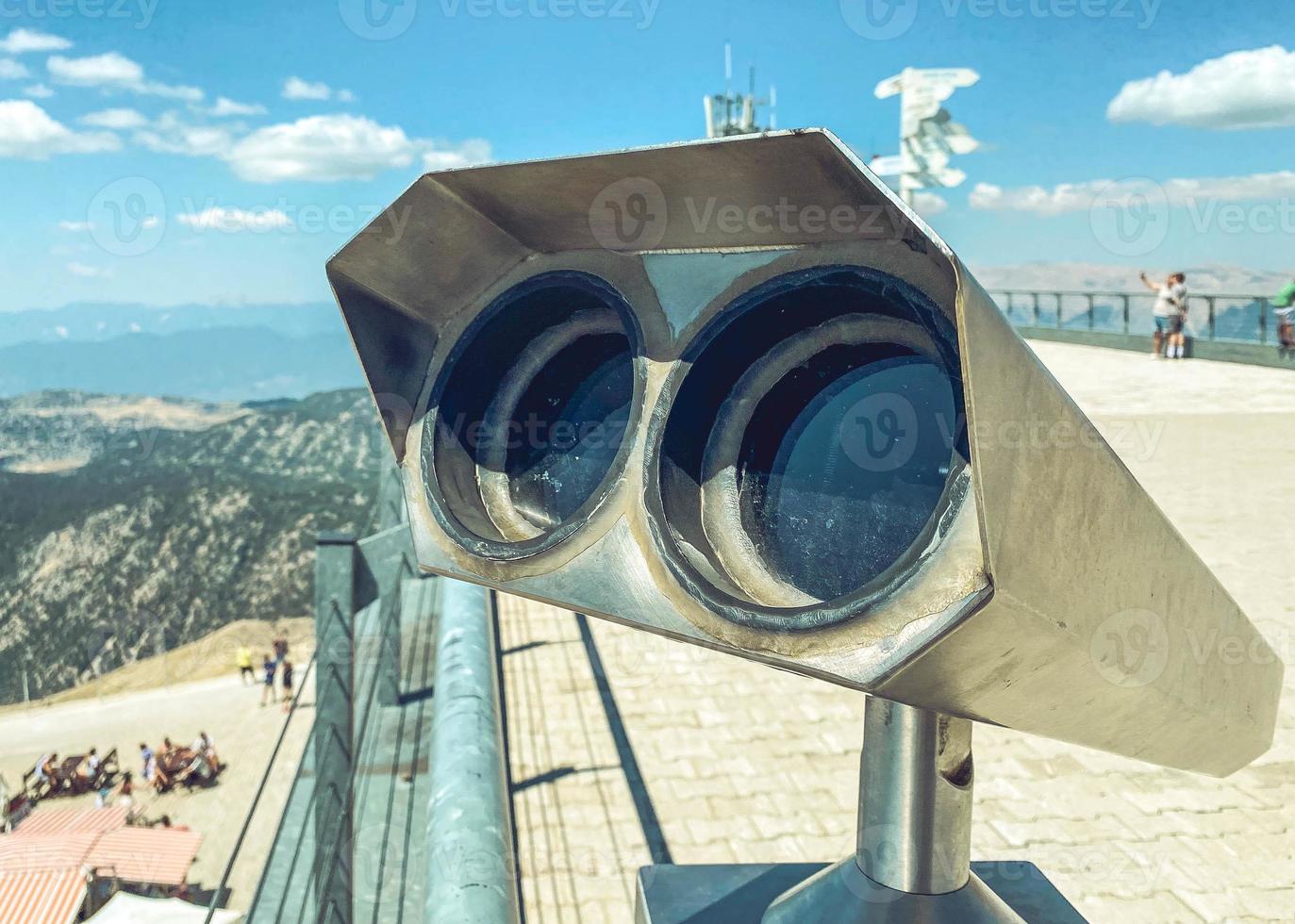 observation deck with binoculars with large black lenses. environment magnifier. panoramic binoculars for tourists photo