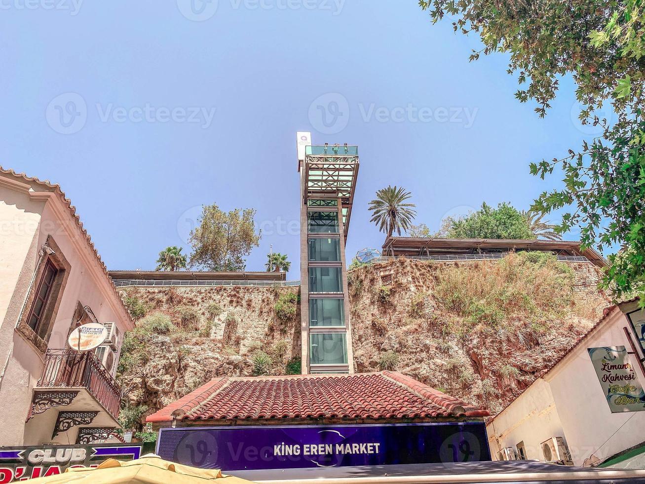 a tall building in a hot, tropical country. for tourists there is an elevator with panoramic windows. lift to the upper floors. sightseeing tour photo