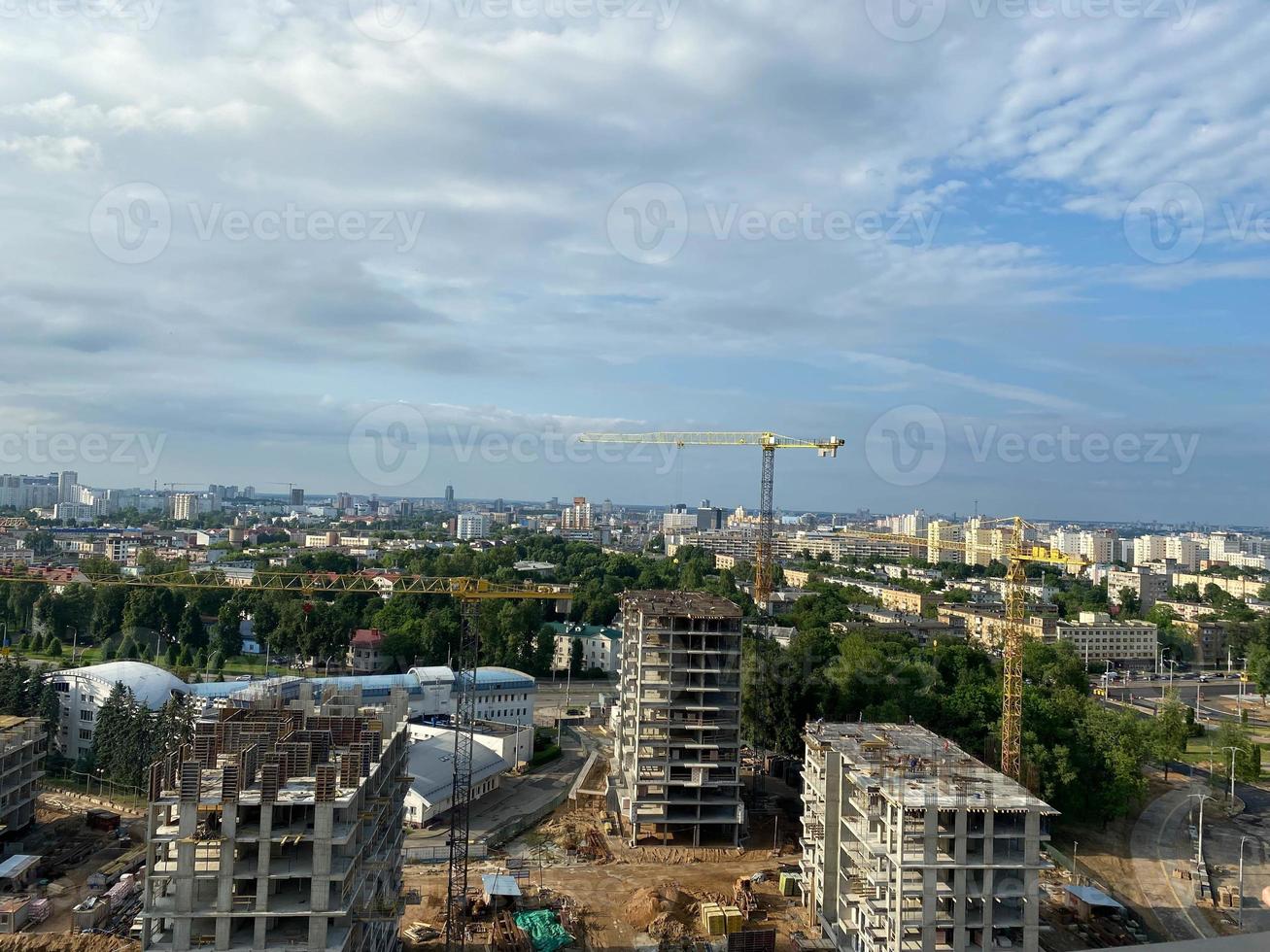 Aerial view construction of a high-rise business center in the big city. Beautiful panoramic landscape of the city at dawn from a height photo