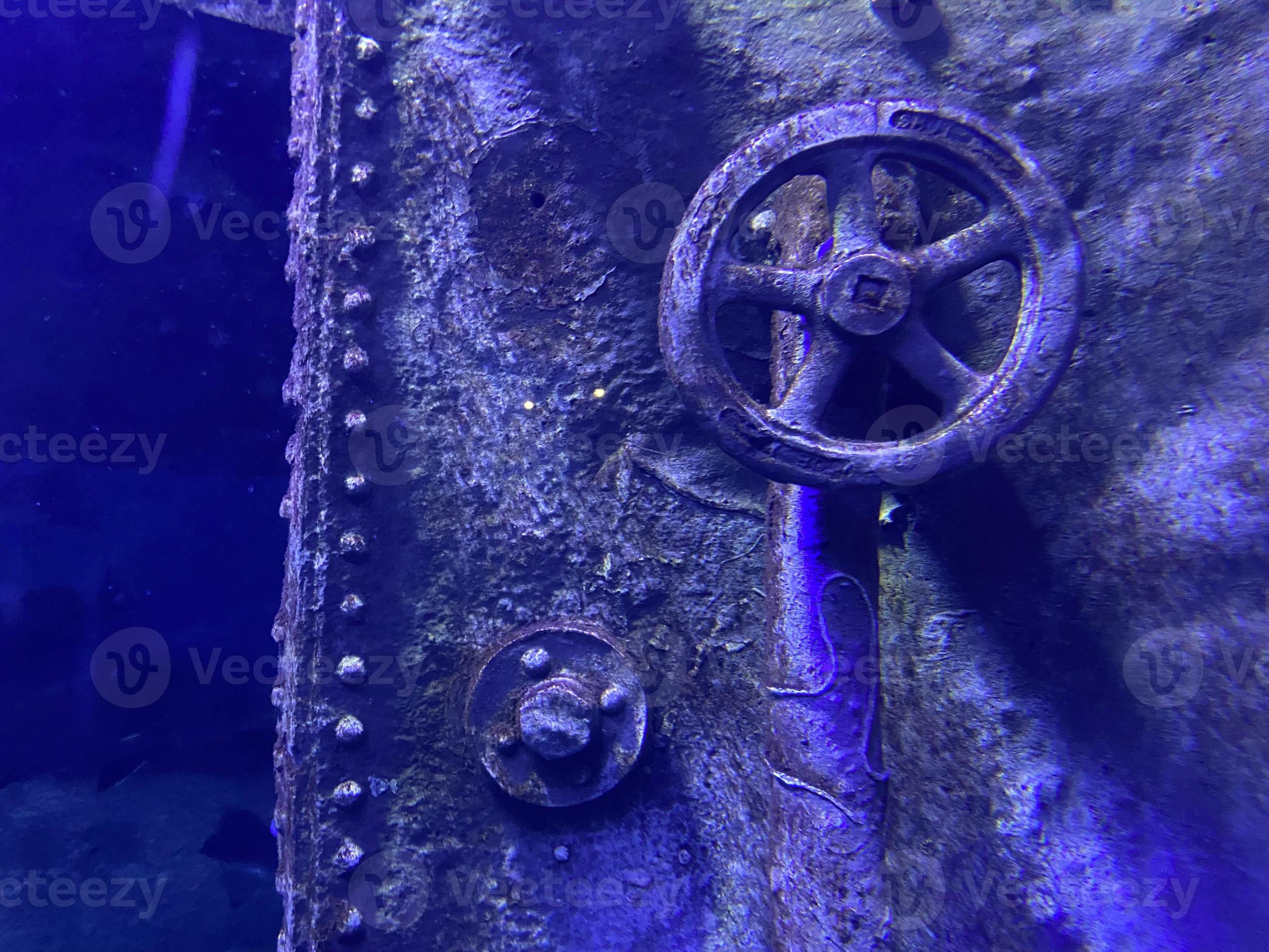closed rusty submarine door with a valve, old vintage interior