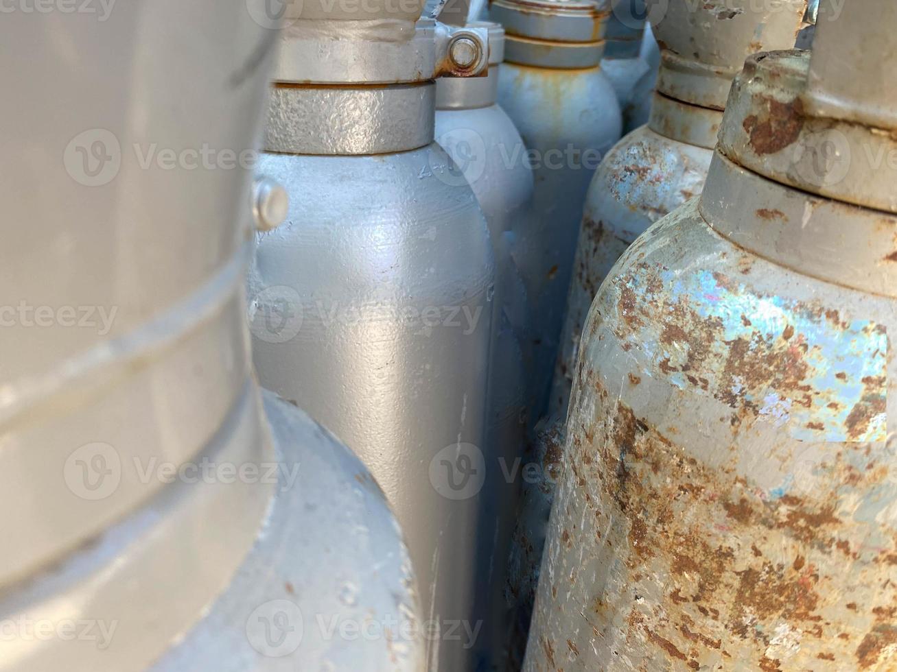 empty tanks propane oxygen nitrogen chemical gas bottles photo
