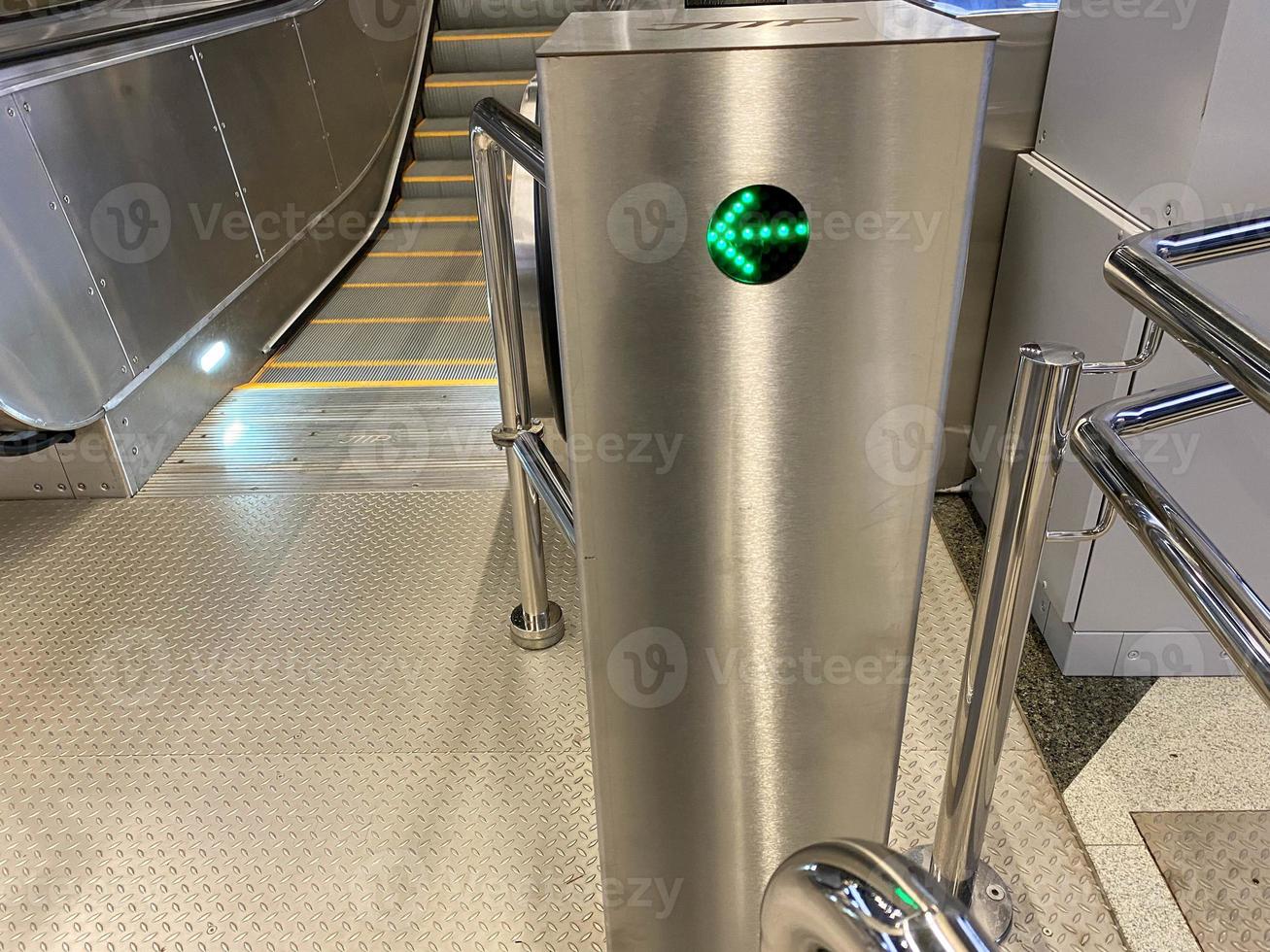 Automatic admission system with a green LED arrow for entering the building and for ascending and descending in the subway or shopping and entertainment center photo