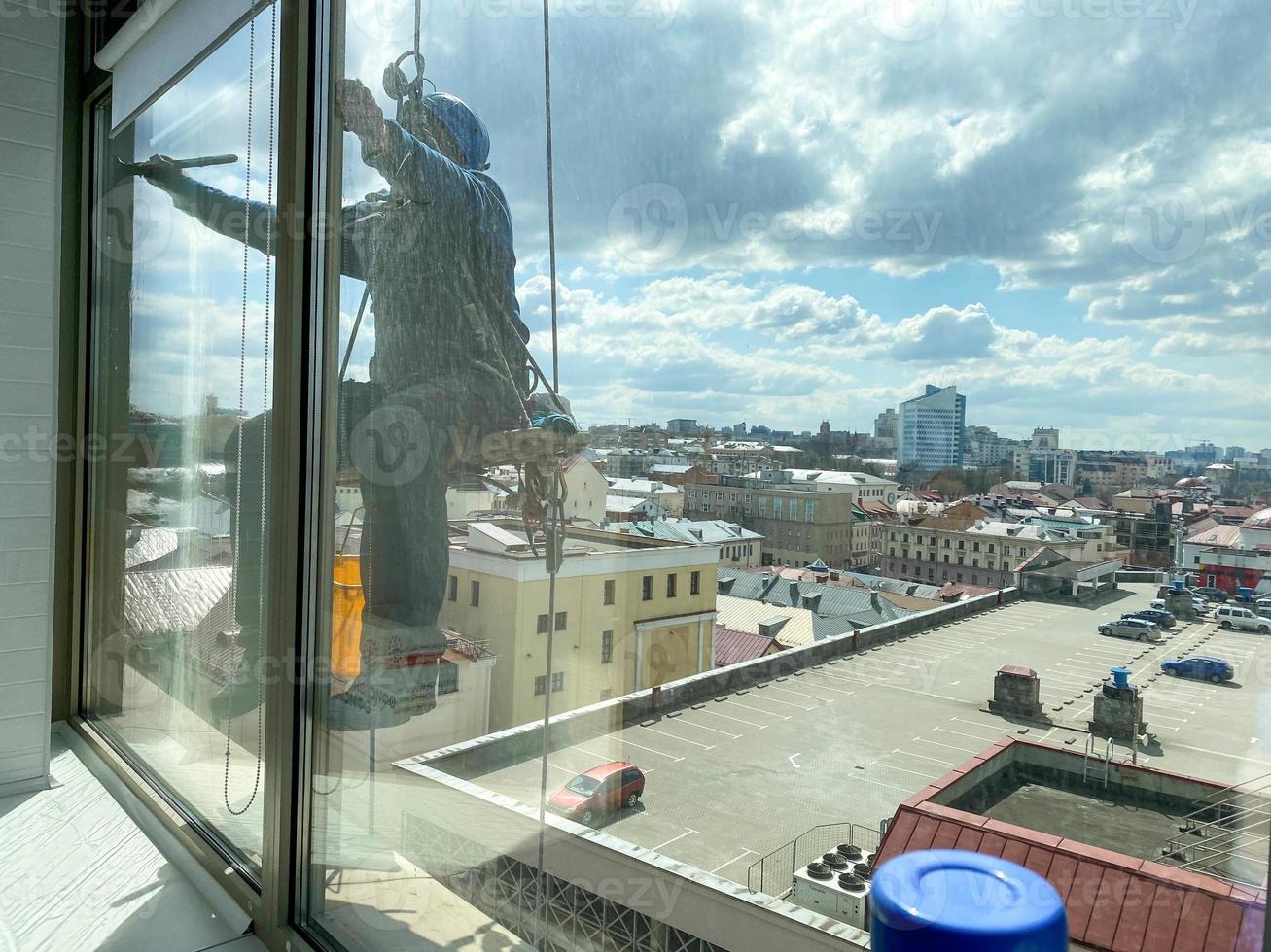 window cleaner with sponge cleaning glass window, Cleaning conept image. photo