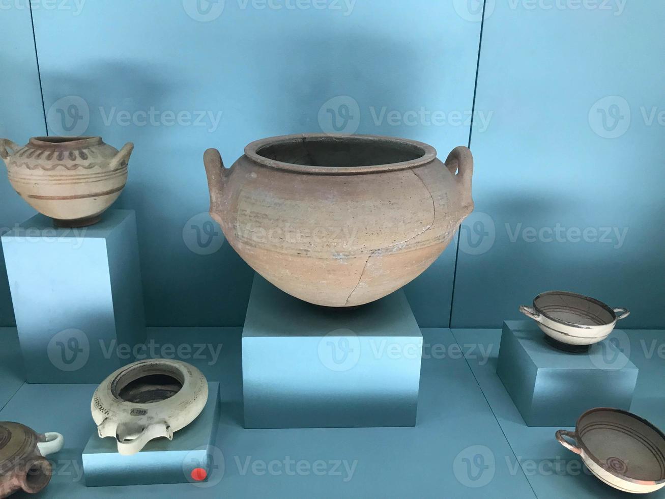 Various amphorae exhibited in the national arcaeological museum . Copper pottery exhibition photo