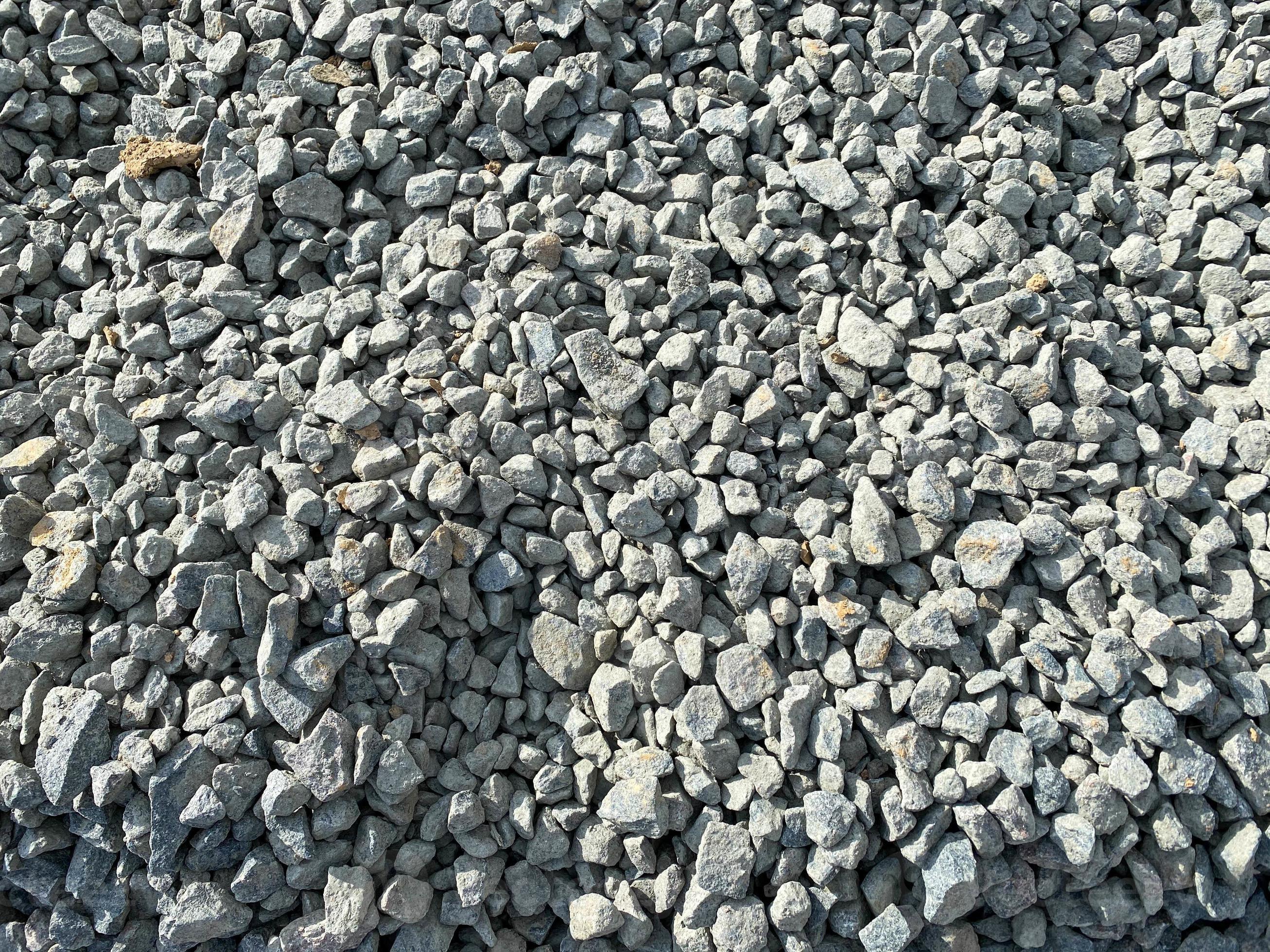 Gray texture of many large sharp hard gray stones, rubble, gravel. The