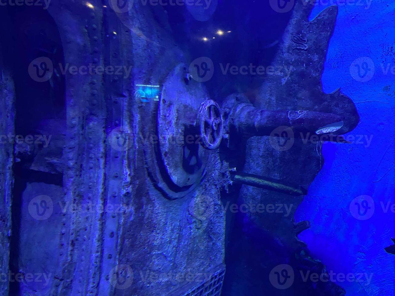 An underwater shot inside a room in the shipwreck of the Kittiwake that uses natural light as opposed to a strobe. The wreck has been sunk deliberately and is shallow enough to allow light penetration photo