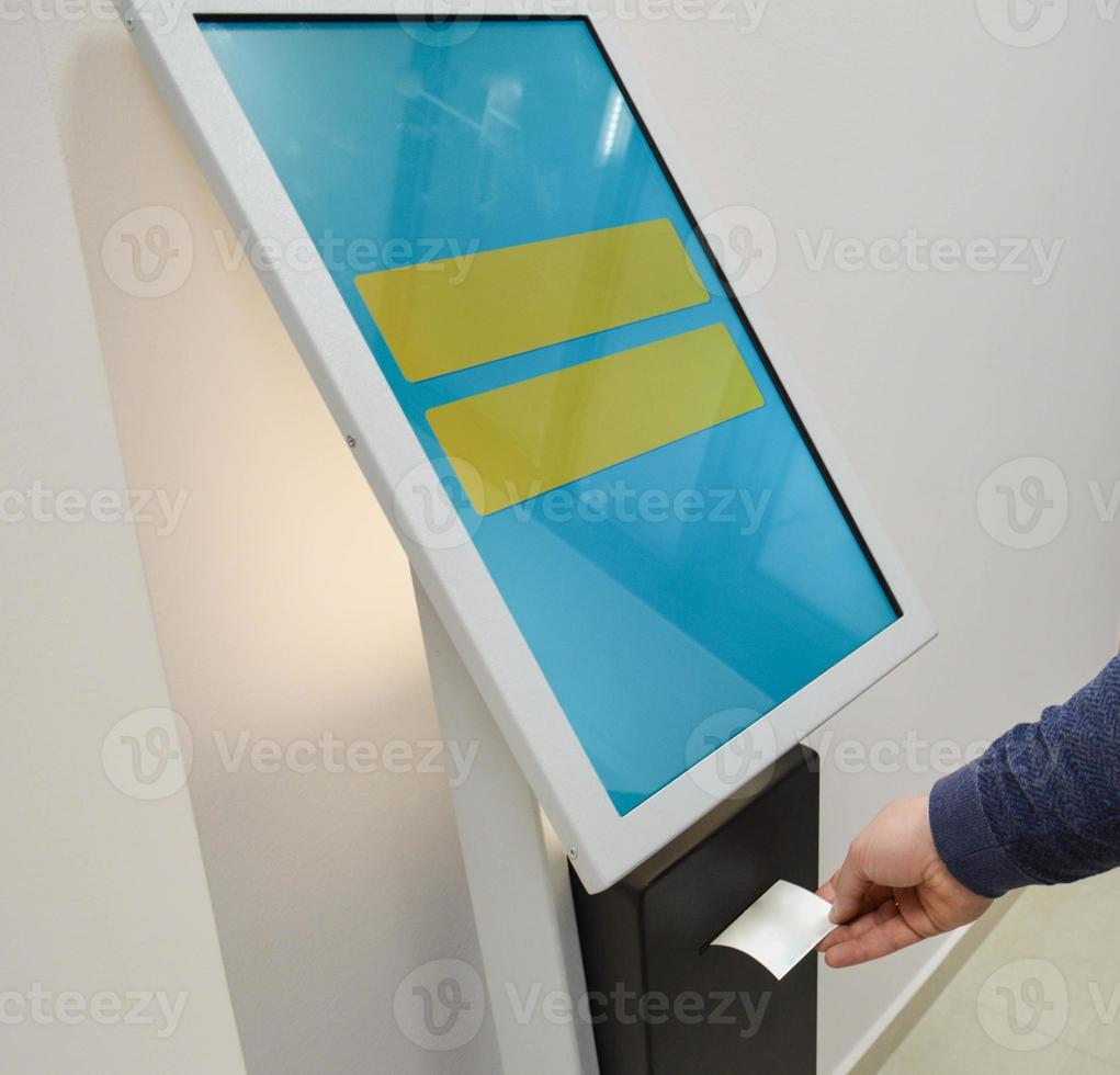 electronic queue for quick customer service. a person takes a number, which indicates the waiting time before the service is provided. fast queue, modern system photo