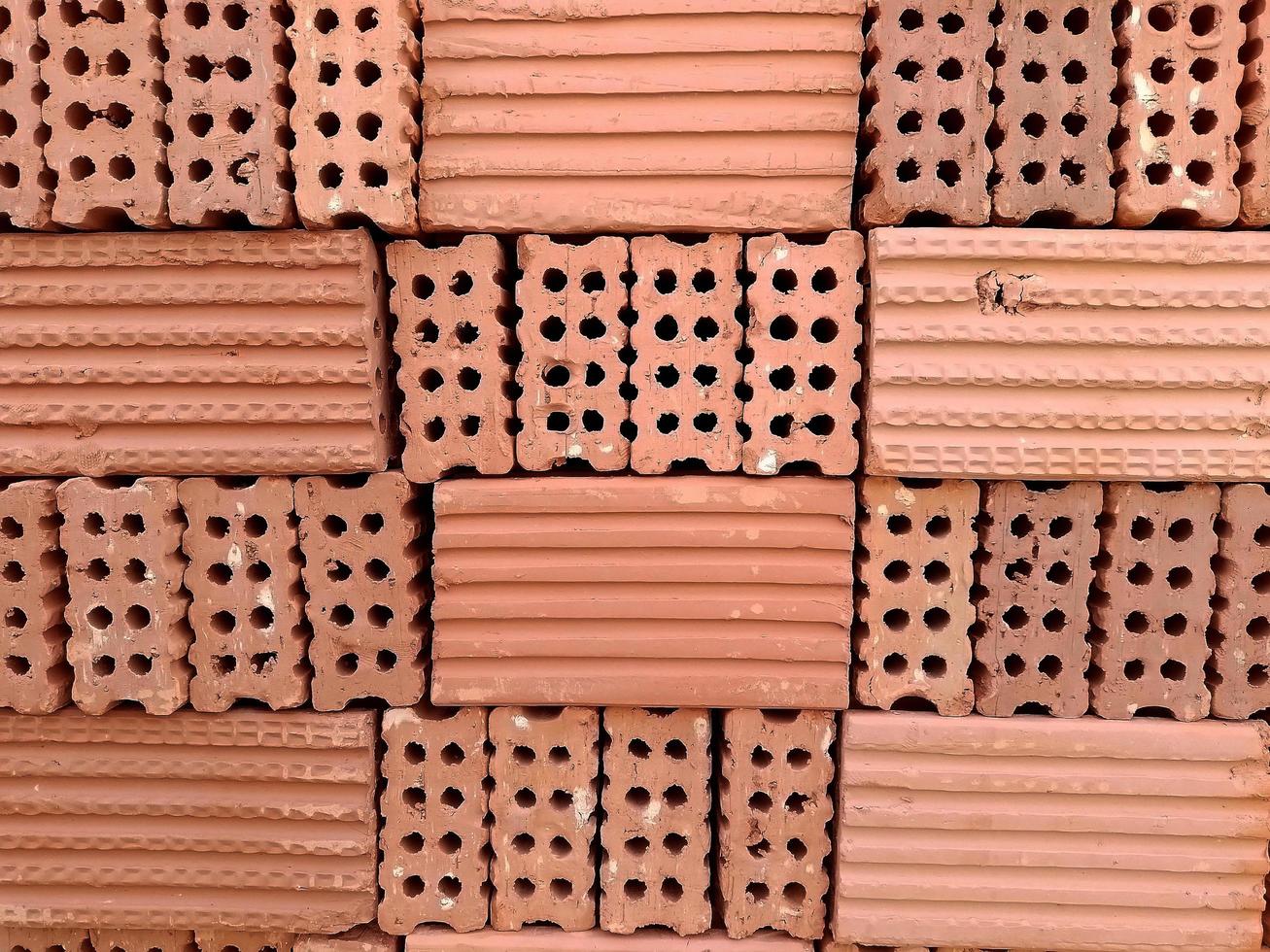 An orderly stack of bricks on a construction site. photo