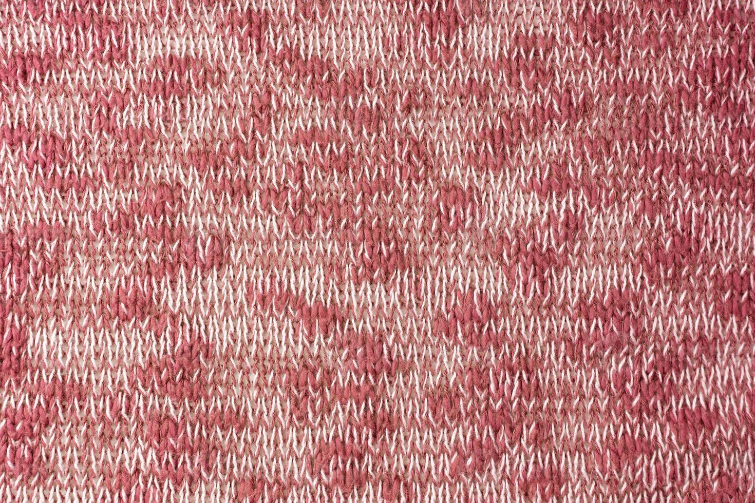 Bright red white melange knitwear wool fabric texture background. Abstract textile backdrop photo