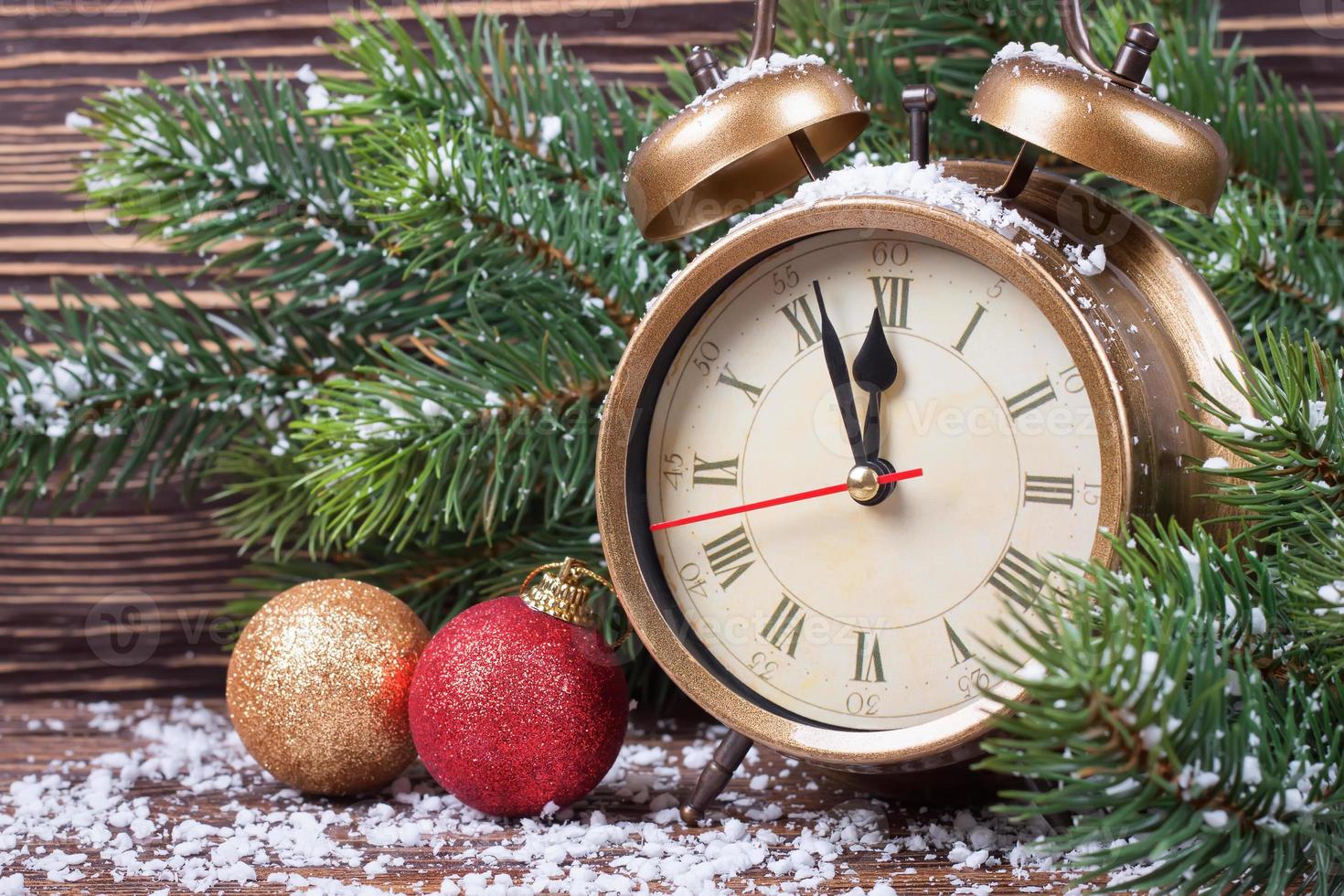 Christmas clock and fir branches photo