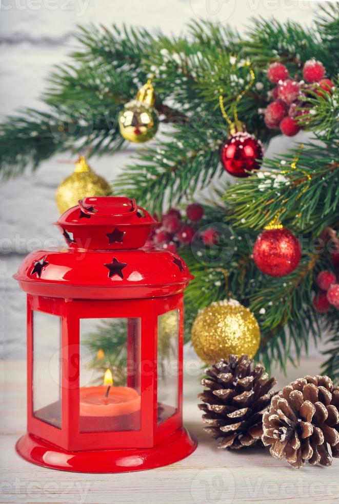 Christmas tree and decorative lantern with a candle. photo