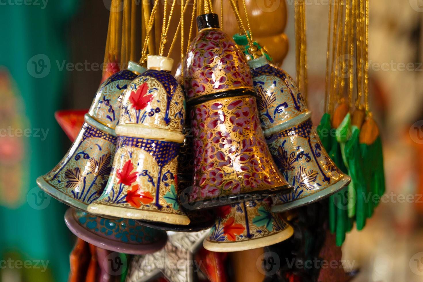 Colorful painted wooden Christmas decorations close-up on a market. Chiang Mai, Thailand. photo