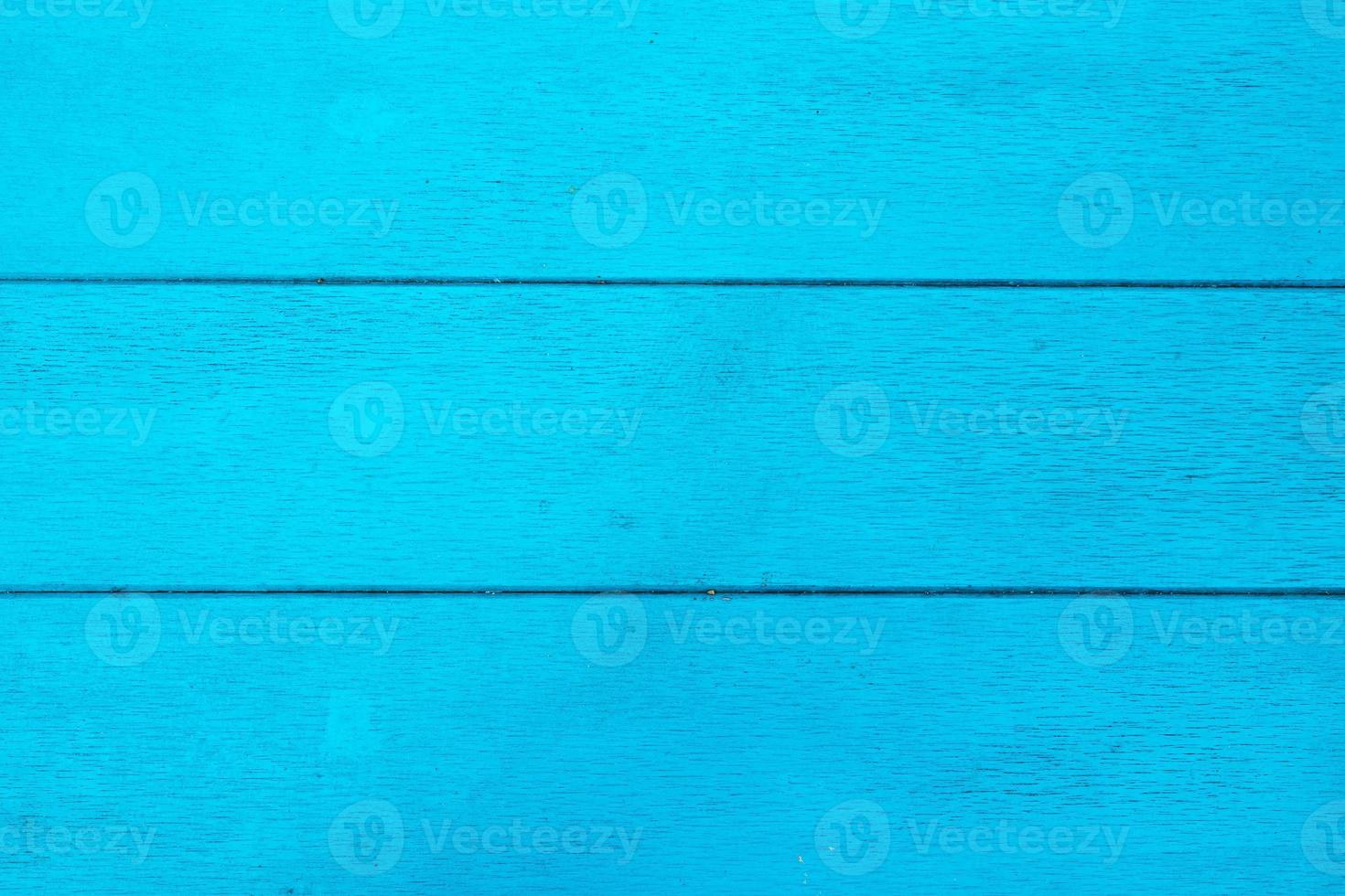 The bright blue textured wooden background, top view. photo