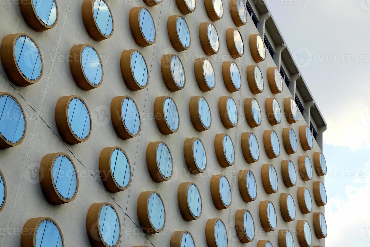 Travel to Bangkok, Thailand. The fragment of a building with round windows. photo