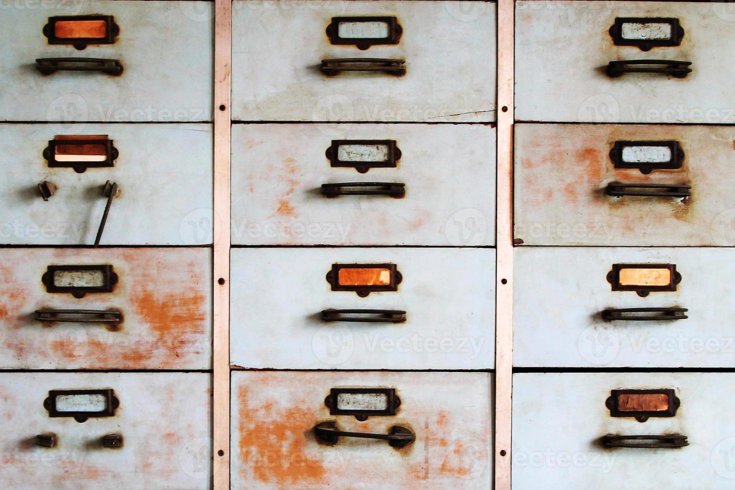 Old metal cabinet with drawers blue color with rusty. photo