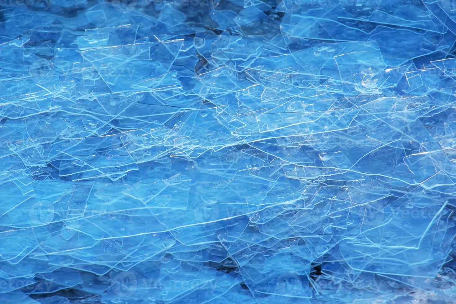 Ice surface of the river. Texture of ice shards. Winter background. photo