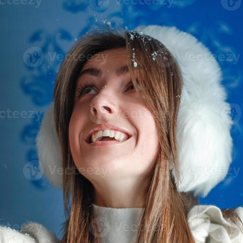 happy woman in fur earmuffs photo