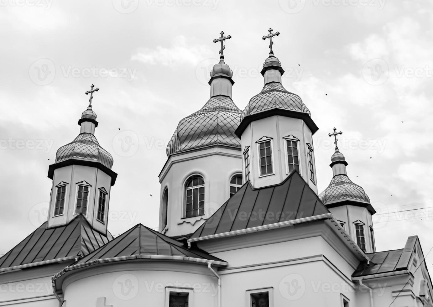 Christian church cross in high steeple tower for prayer photo