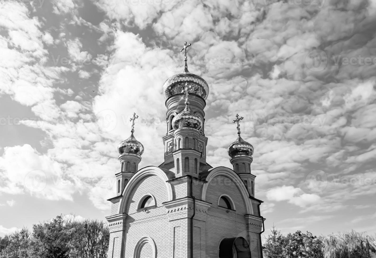 Christian church cross in high steeple tower for prayer photo