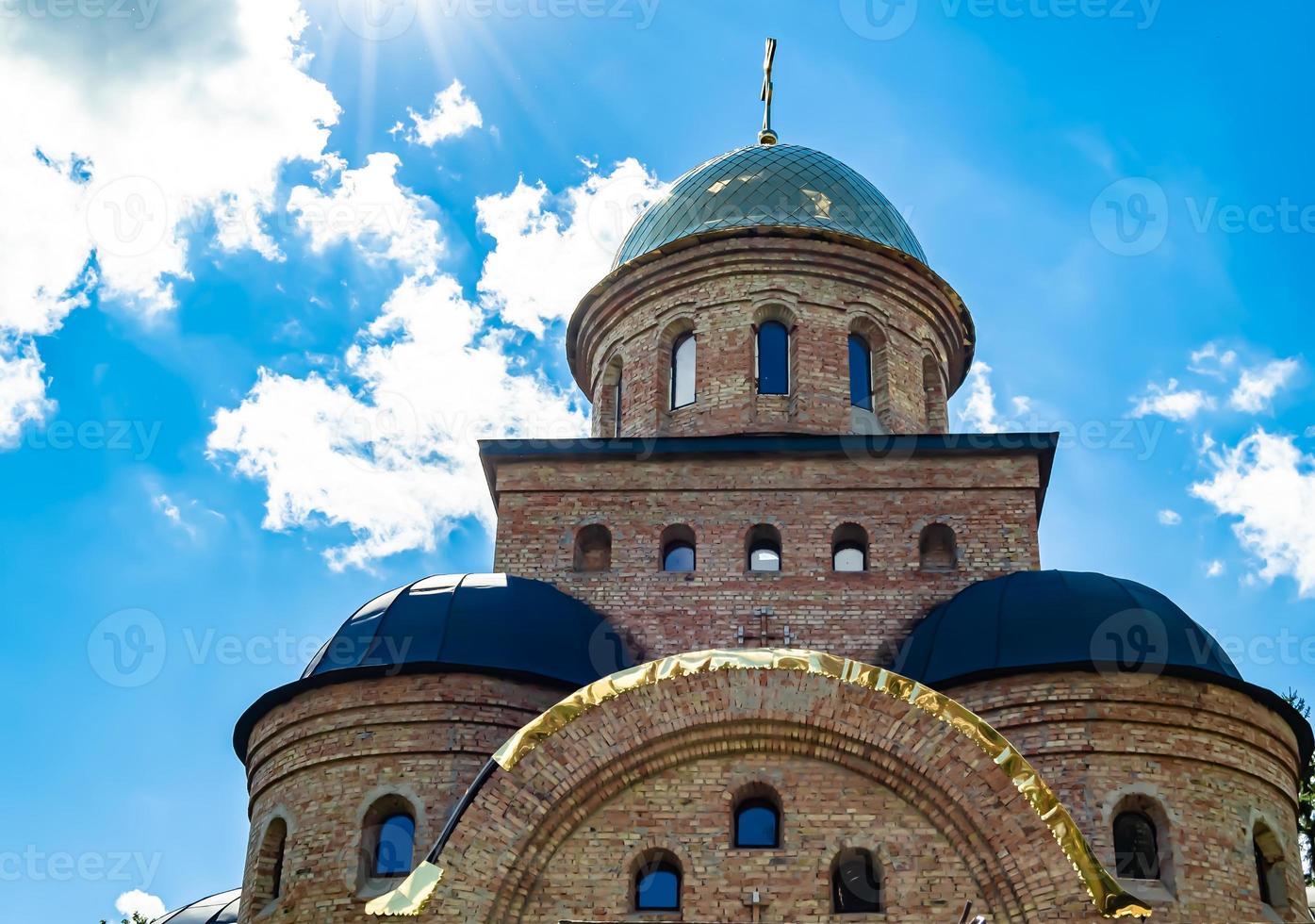 Christian church cross in high steeple tower for prayer photo