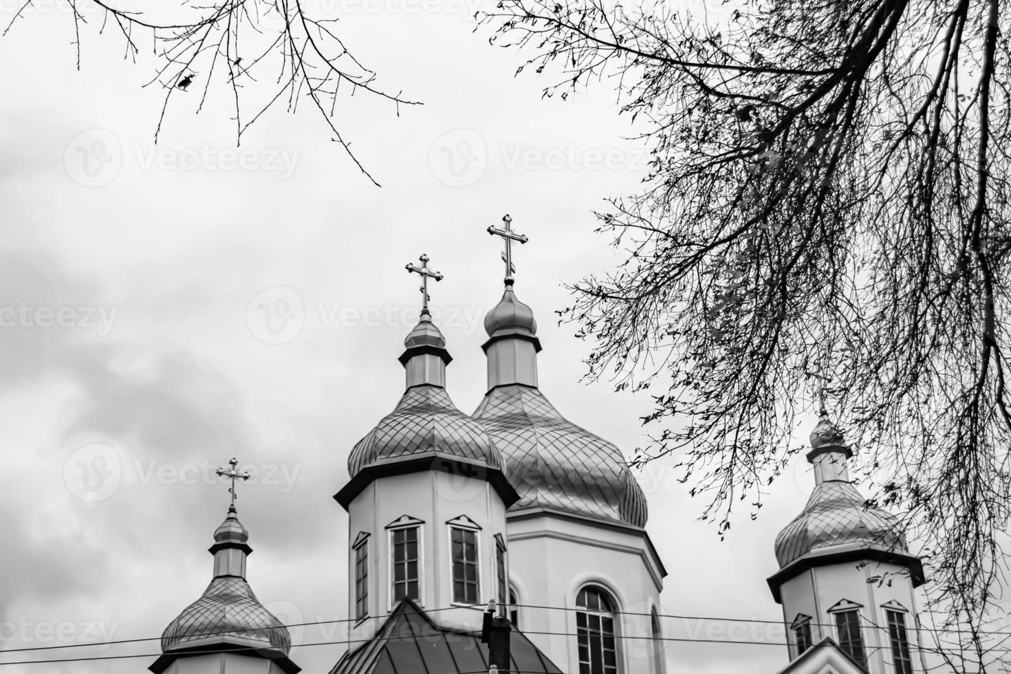 Christian church cross in high steeple tower for prayer photo