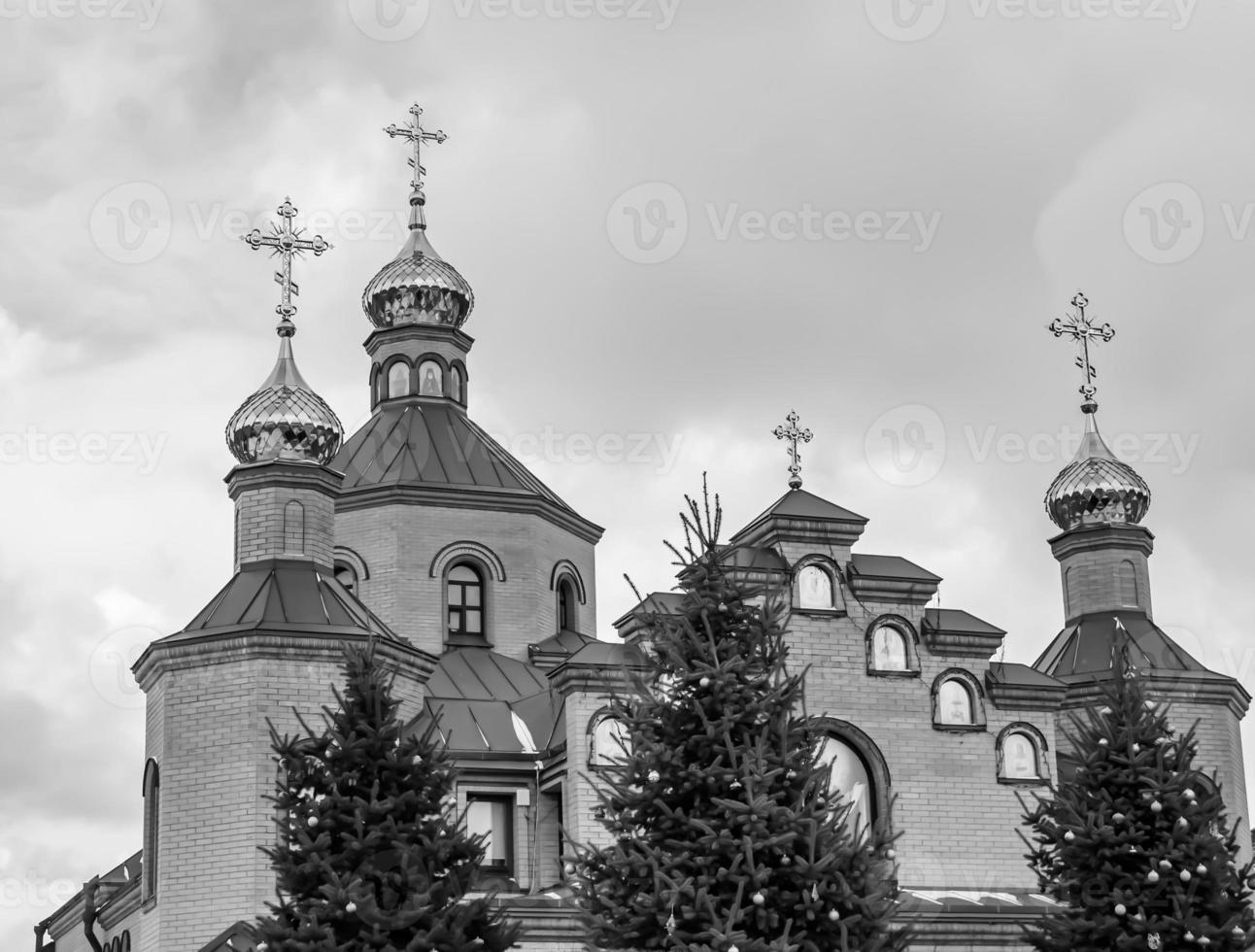 Christian church cross in high steeple tower for prayer photo