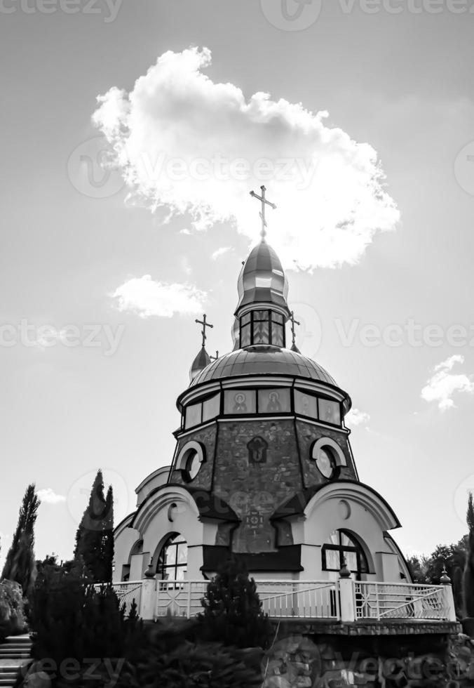 Christian church cross in high steeple tower for prayer photo