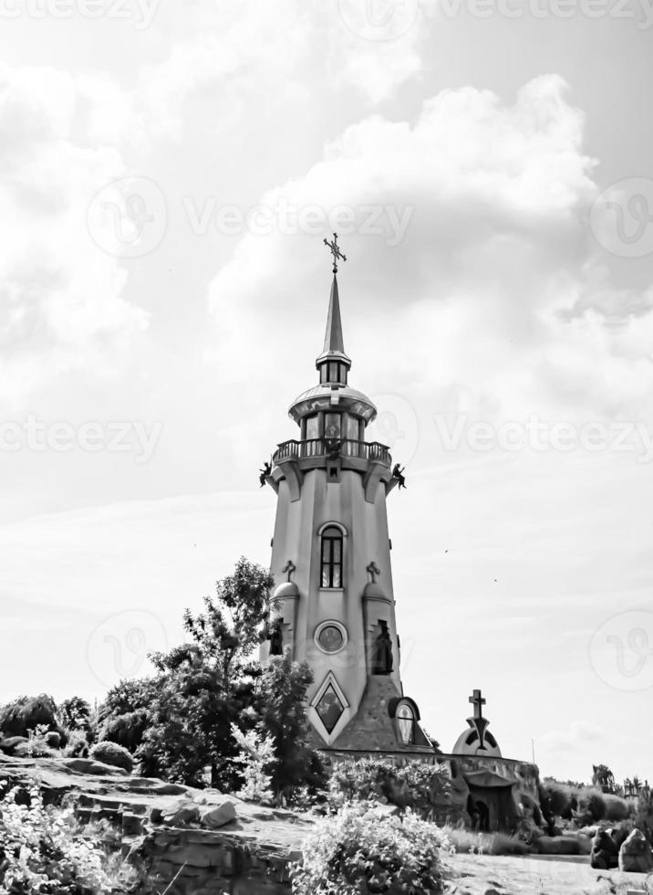 Christian church cross in high steeple tower for prayer photo