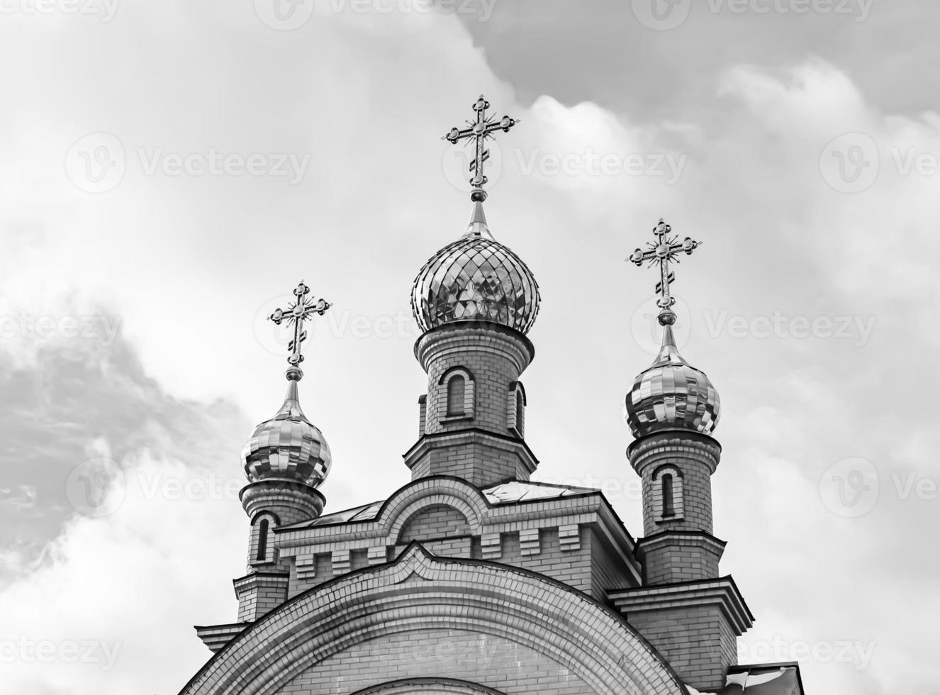 Christian church cross in high steeple tower for prayer photo