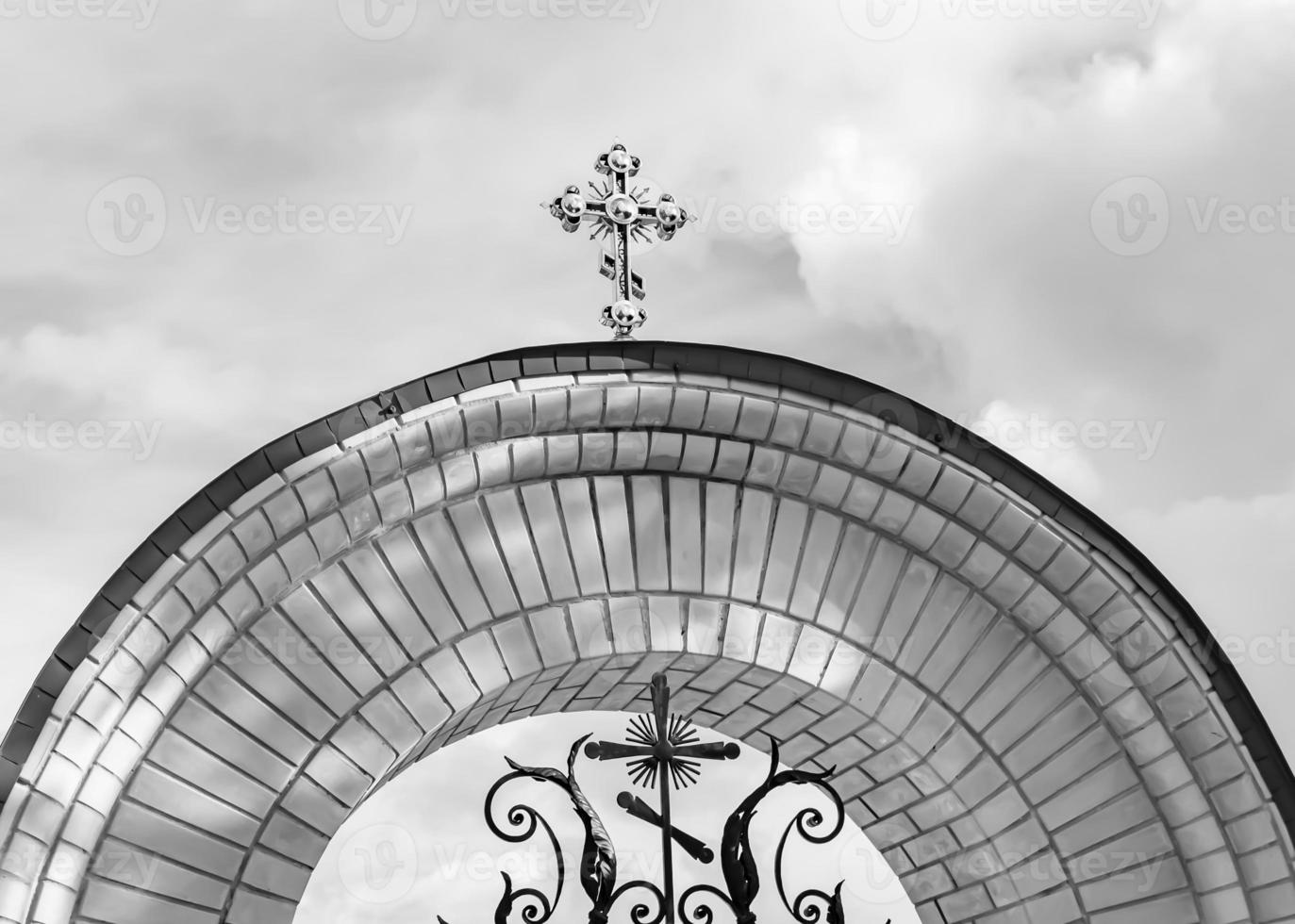 Christian church cross in high steeple tower for prayer photo