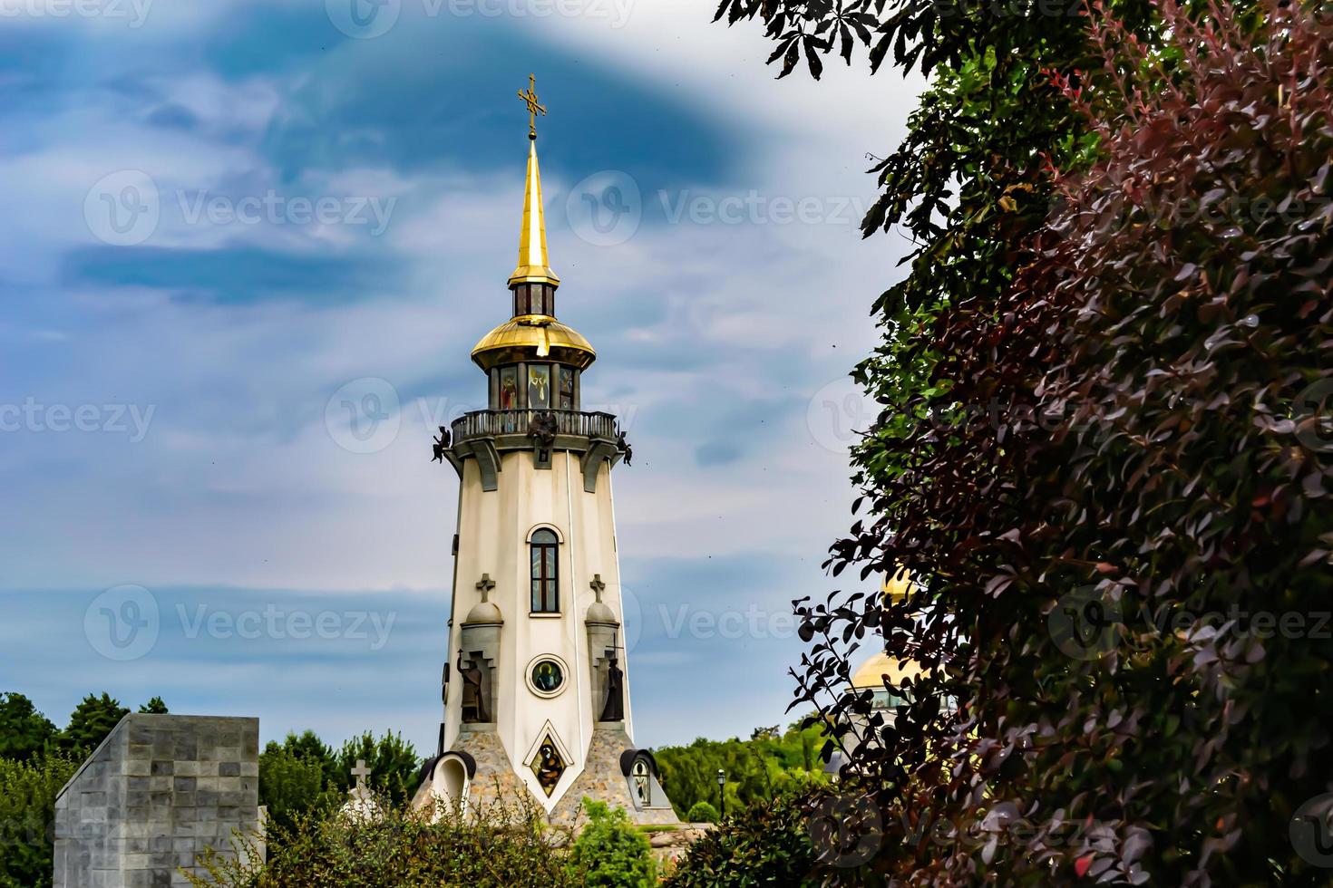 Christian church cross in high steeple tower for prayer photo