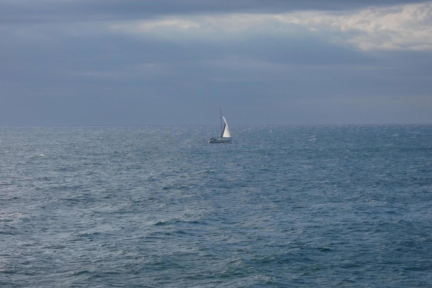 Sailboat sailing in the mediterranean sea, calm waters photo