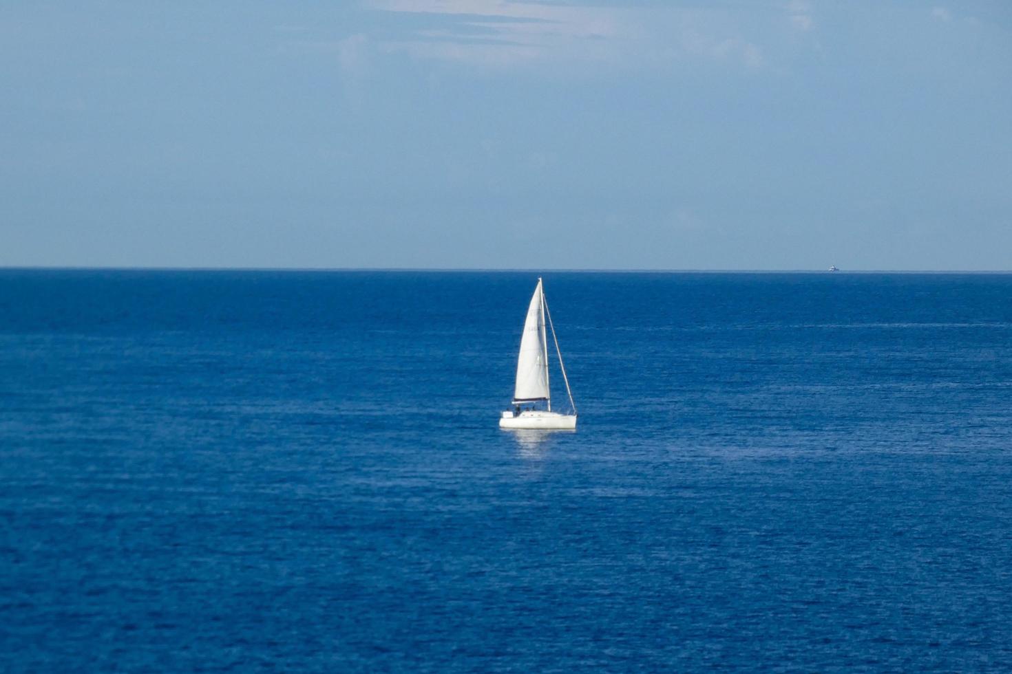 Sailboat sailing in the mediterranean sea, calm waters photo