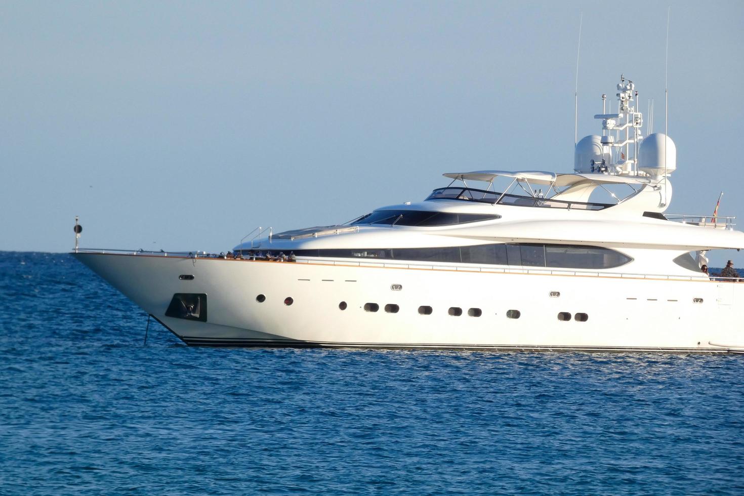 modern yacht anchored in the middle of a bay on the costa brava photo